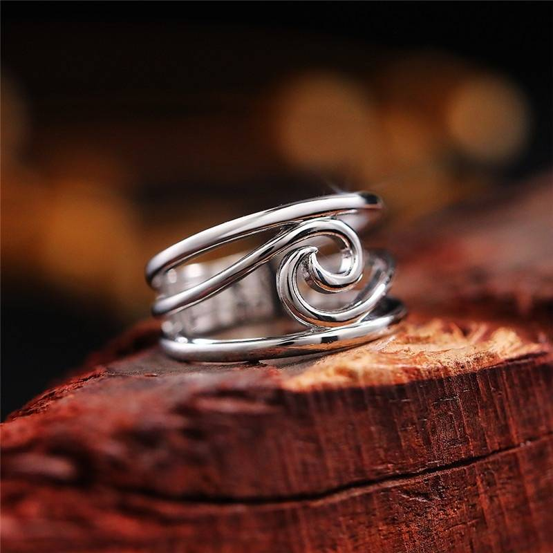 Retro ring met golf in wit goud