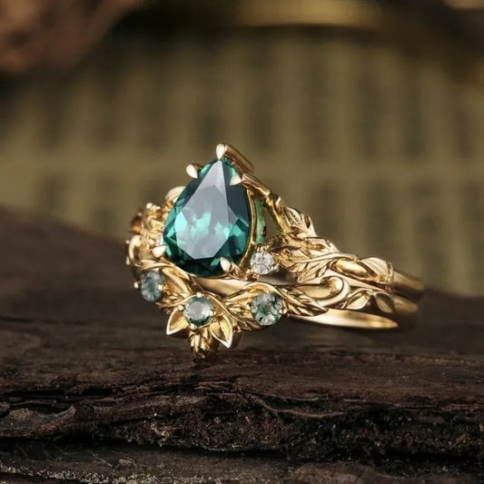 Retro ring met groene bloemsteen in goud