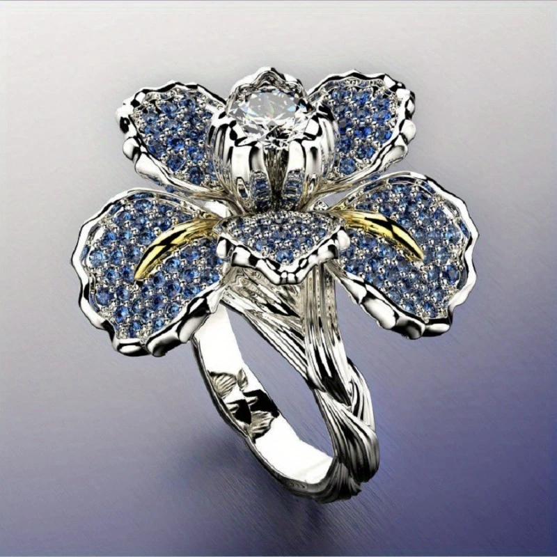 Ring met blauwe bloemen en kristal in wit goud