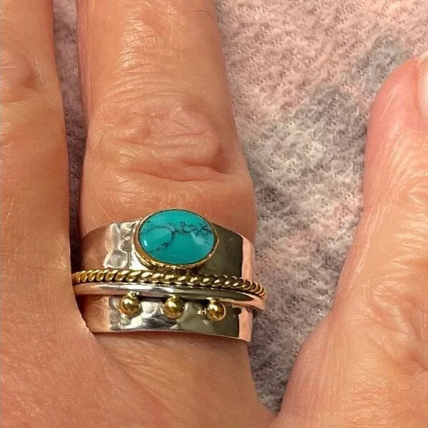 Brede ring met turquoise in goud