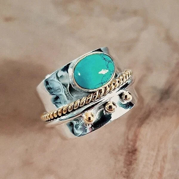 Brede ring met turquoise in goud