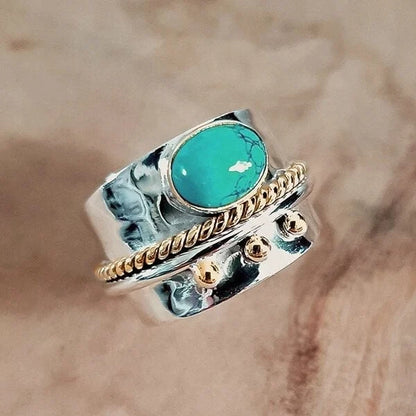 Brede ring met turquoise in goud