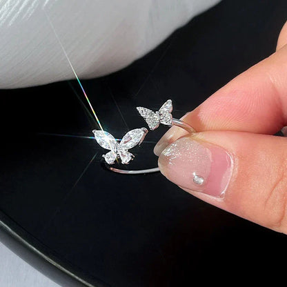 Verstelbare ring met stralende vlinder in wit goud