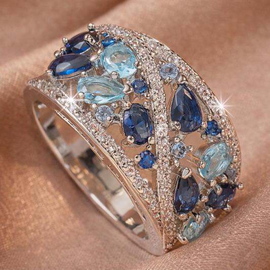Retro ring met blauwe steentjes in goud