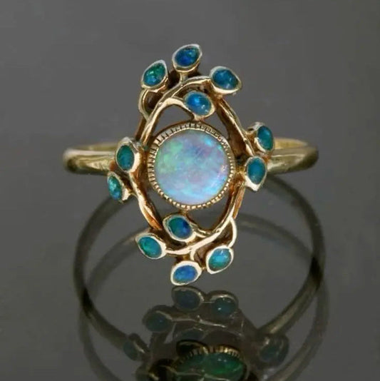 Blauwe retro ring met kristallen en opaal in goud