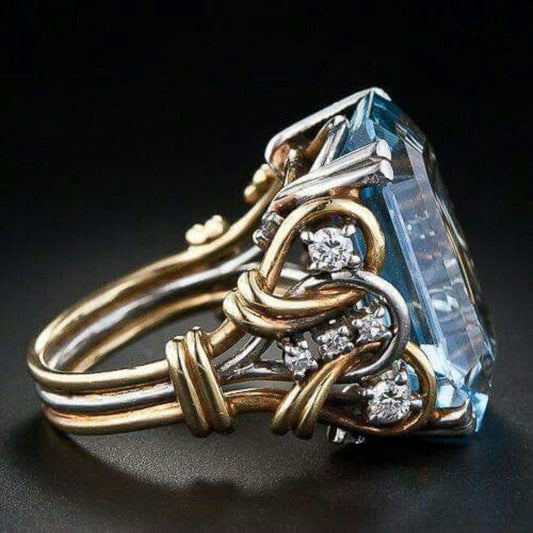 Retro ring met rijen blauwe steentjes in goud