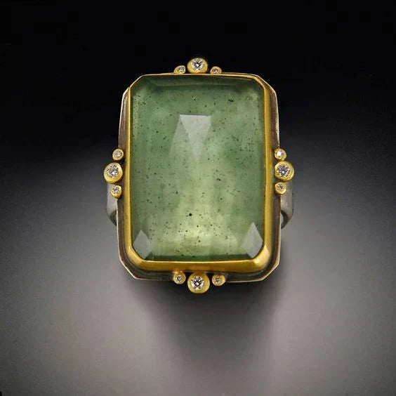 Vintage ring met groen glas in goud