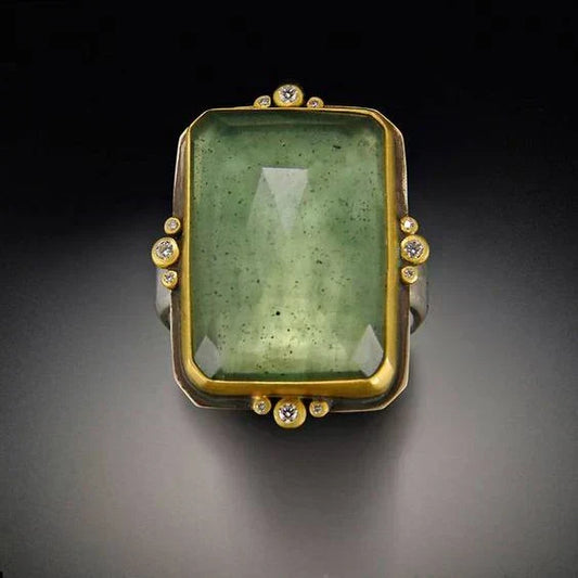 Vintage ring met groen glas in goud