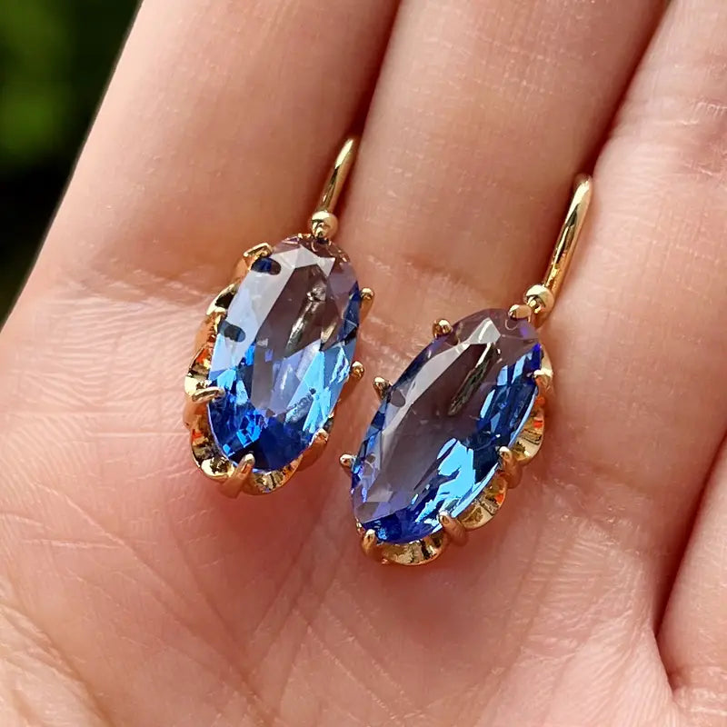 Blauwe bloemoorbellen in goud