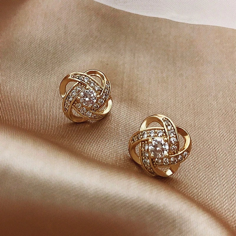 Oorbellen met glinsterende bolletjes in goud