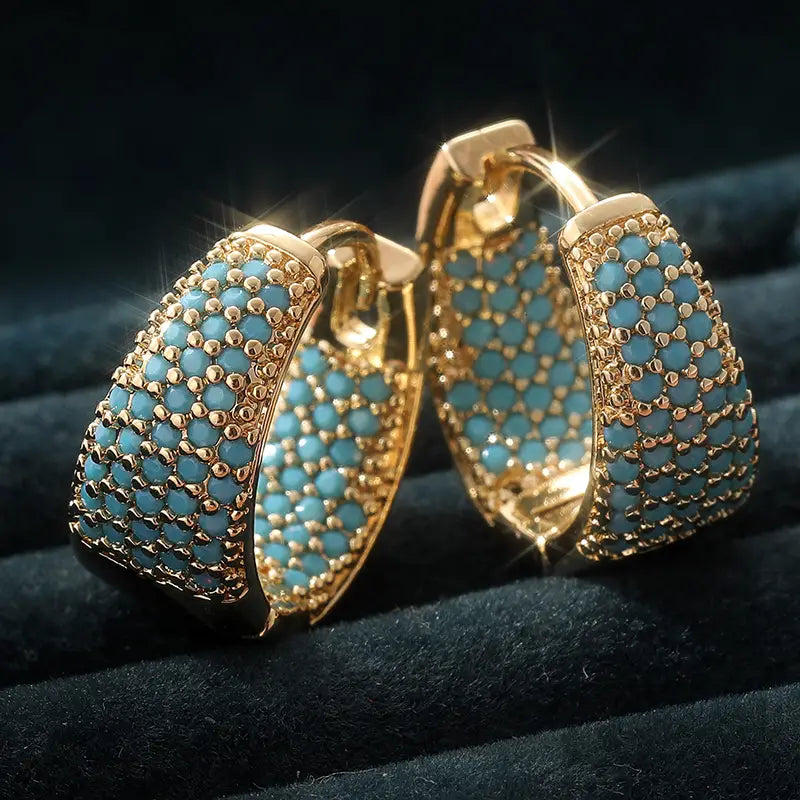 Creolen met turquoise parels in goud