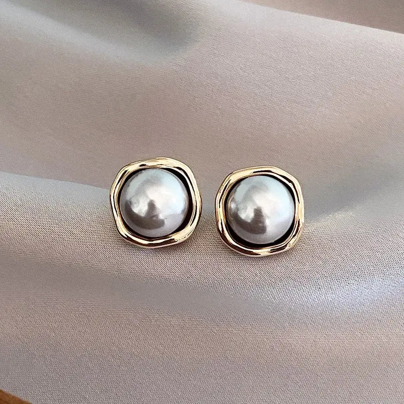 Elegante zwarte parel-oorbellen in goud