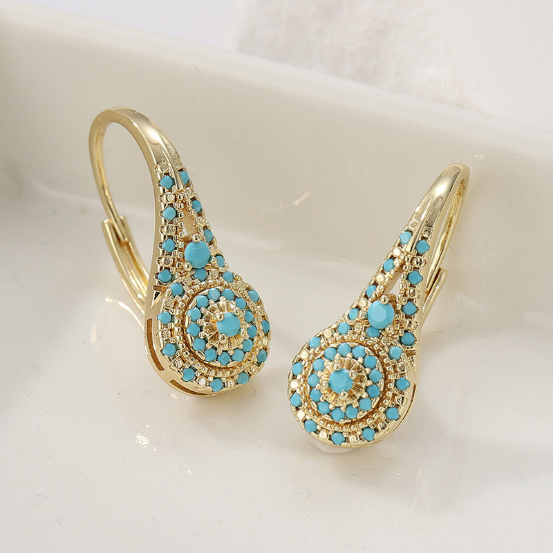 Turquoise tros-oorbellen Valenne in goud
