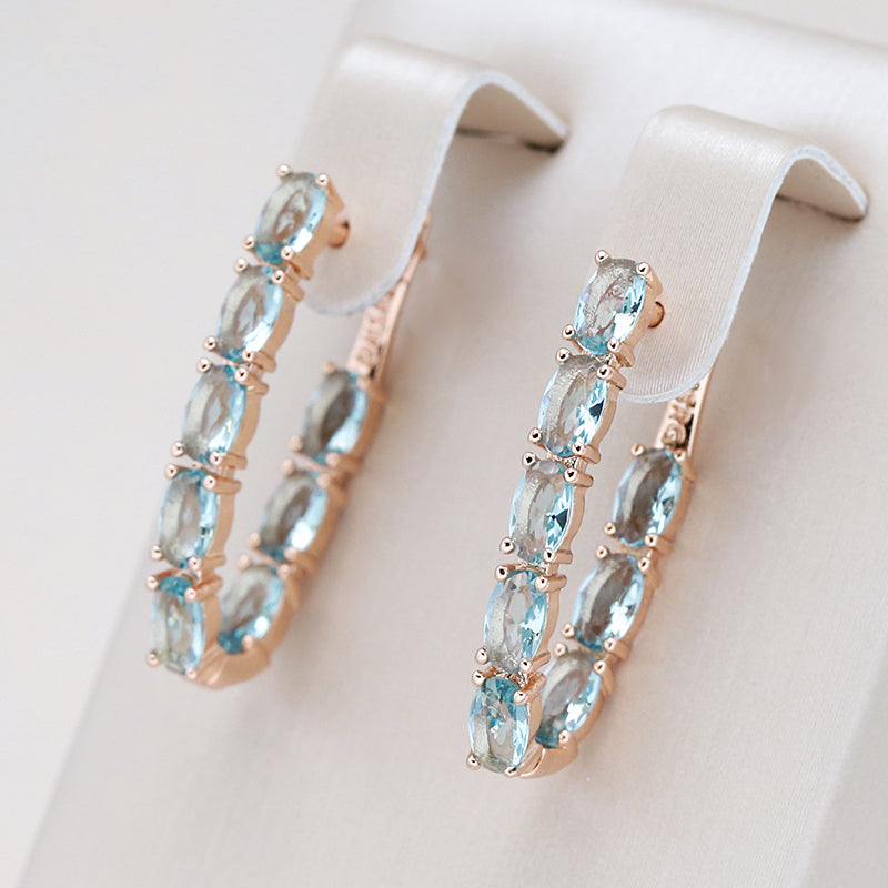 Turquoise hangoorbellen met steentjes in goud