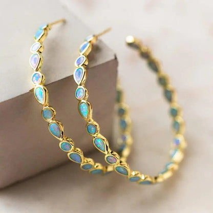 Retro oorbellen met blauw opaal in goud