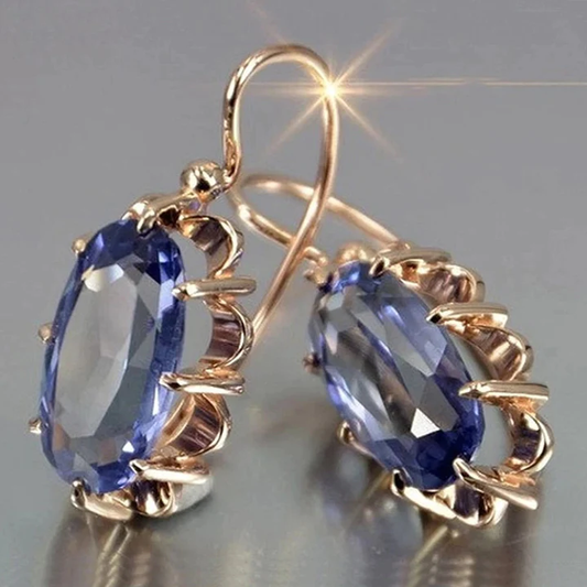 Vintage oorbellen met blauwe steentjes | Goud