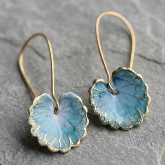 Vintage blauwe bladoorbellen in goud
