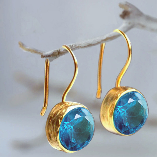 Vintage oorbellen met blauwe kristallen | Goud