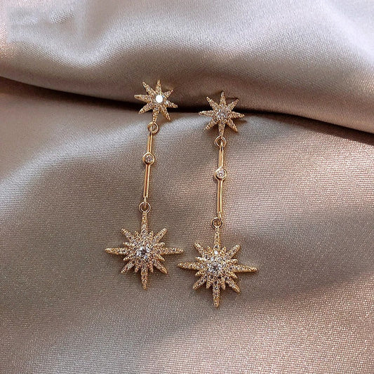 Vintage oorbellen met kristallen ster | Goud