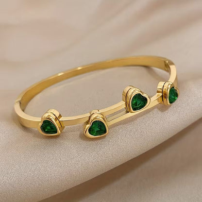 Groene hartjesarmband in goud