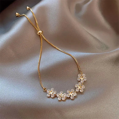 Kristallen madeliefjesarmband in goud