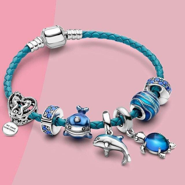 Oceaanarmband met leren bedels in wit goud