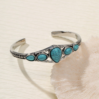 Open armband met turquoise druppel | Witgoud