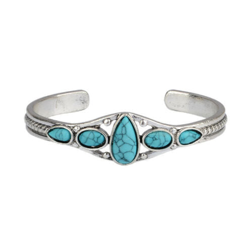 Open armband met turquoise druppel in wit goud