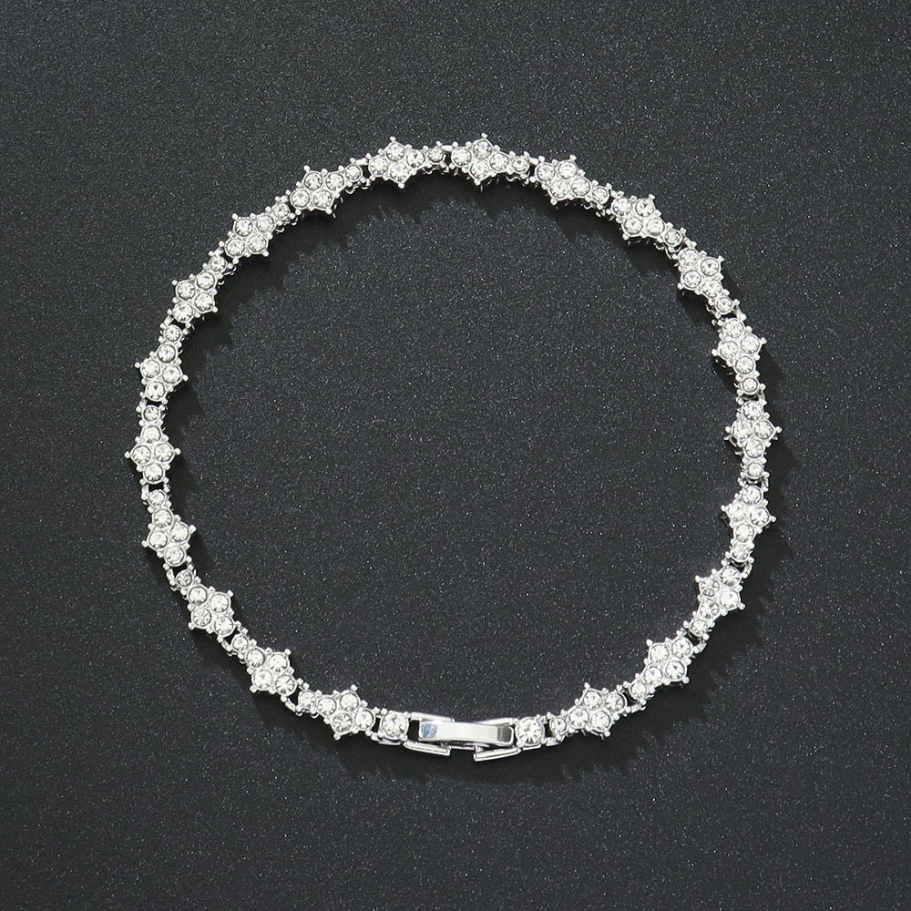 Klassieke tennisarmband met clusters in goud