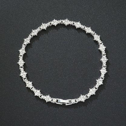 Klassieke tennisarmband met clusters in goud