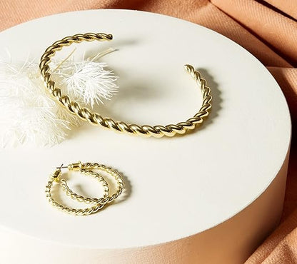 Gedraaide armband in goud