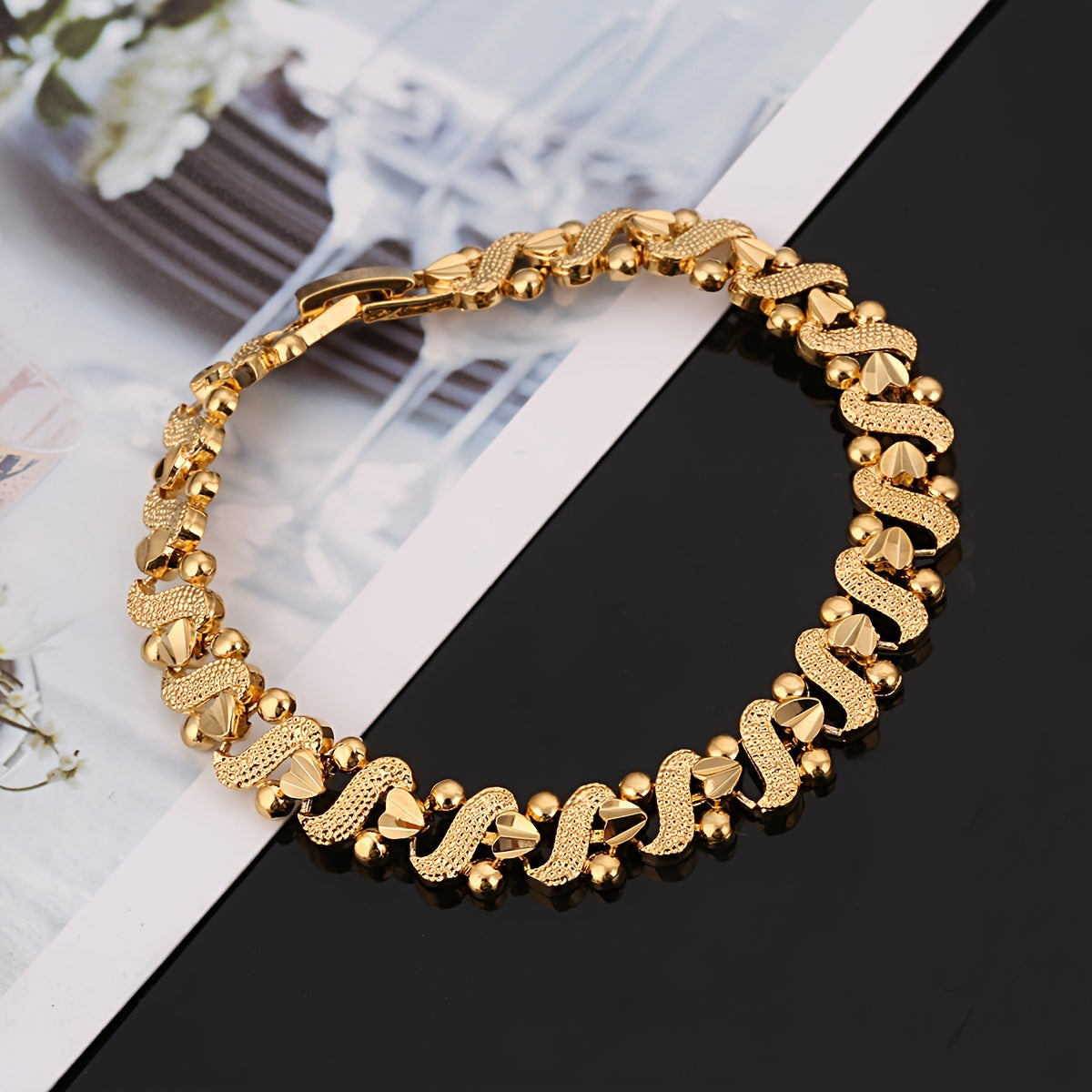 Golvende lelie-armband in goud
