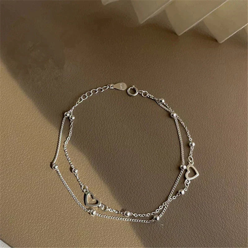 Verstelbare armband met hart in wit goud