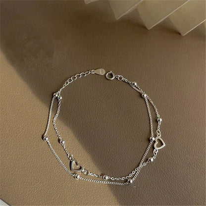 Verstelbare armband met hart in wit goud