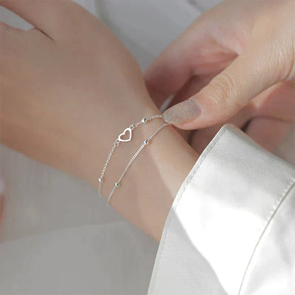 Verstelbare armband met hart in wit goud
