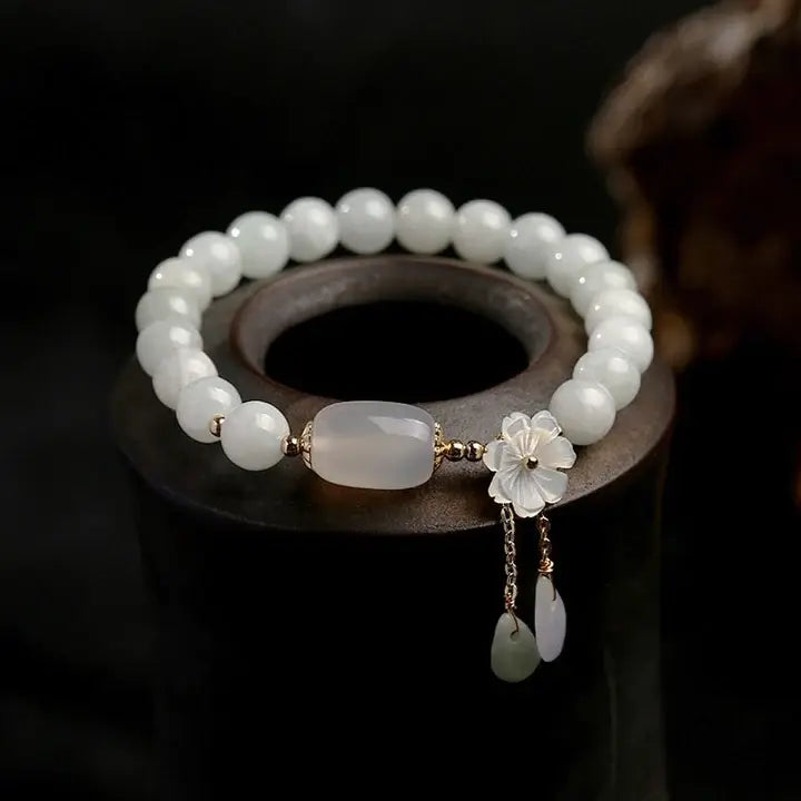 Armband met aquamarijn en madeliefjes in goud
