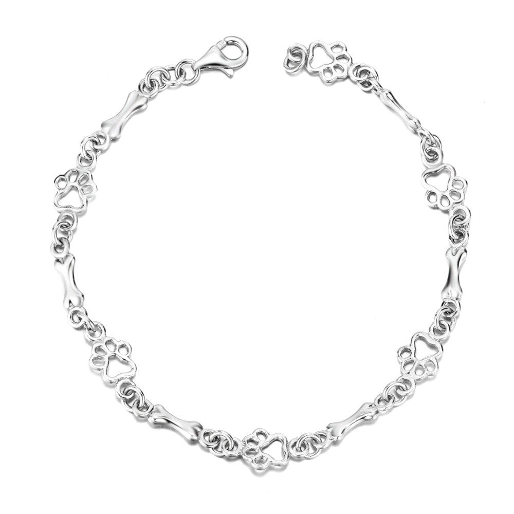 Armband met hondenpootjes en botje, gelimiteerde oplage | Witgoud