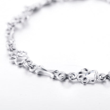 Armband met hondenpootjes en botje, gelimiteerde oplage | Witgoud