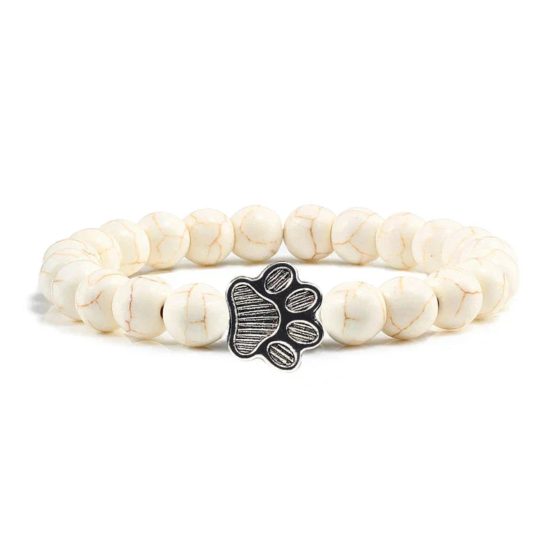 Armband met pootjeskralen van natuursteen | Goud