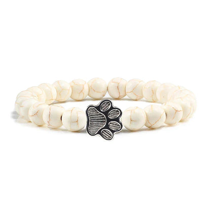 Armband met pootjeskralen van natuursteen | Goud