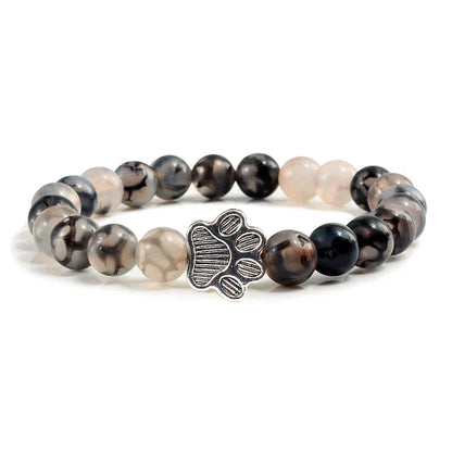 Armband met pootjeskralen van natuursteen | Goud