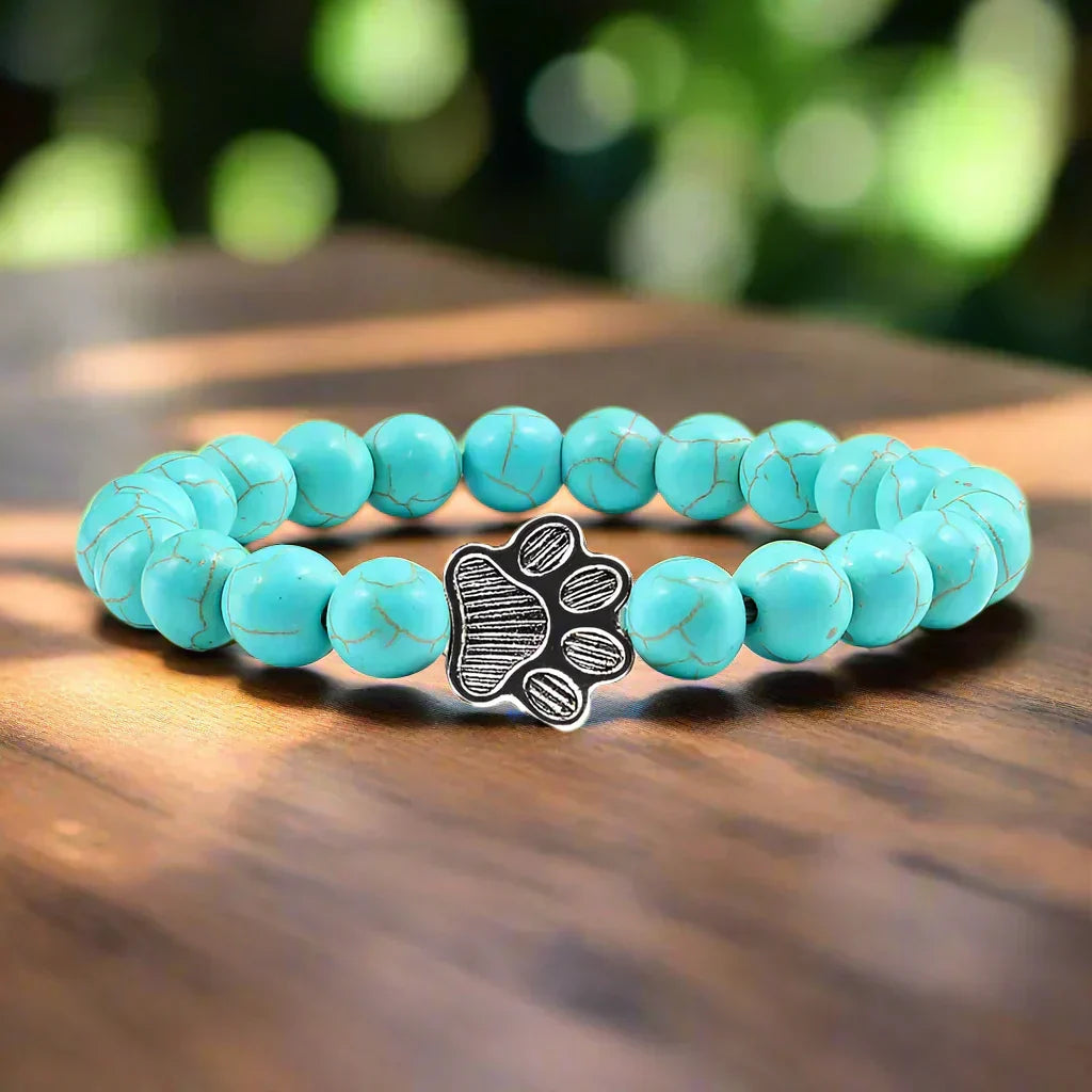 Armband met pootjeskralen van natuursteen | Goud