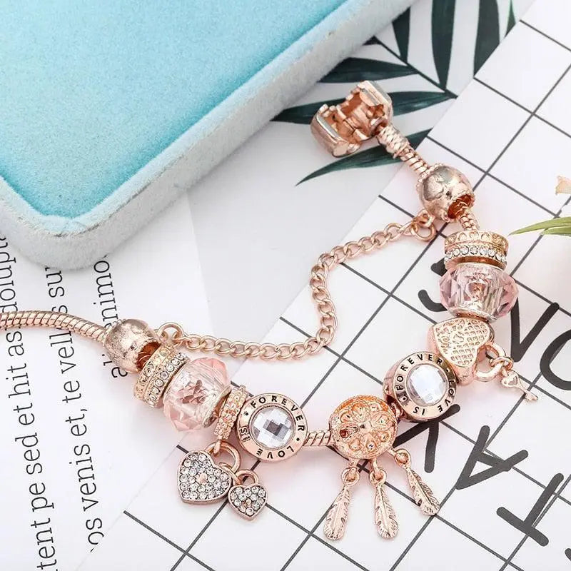 Roze dromenvangerarmband met bedels in wit goud