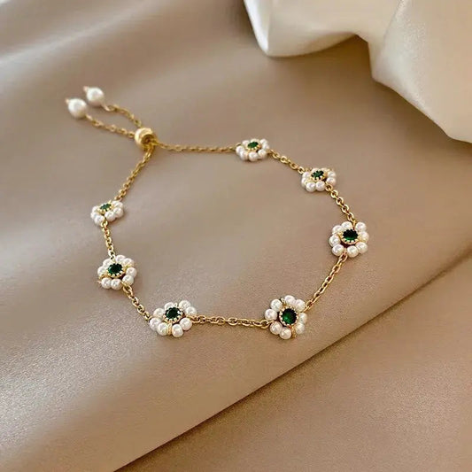 Elegante armband met groene kristallen | Goud