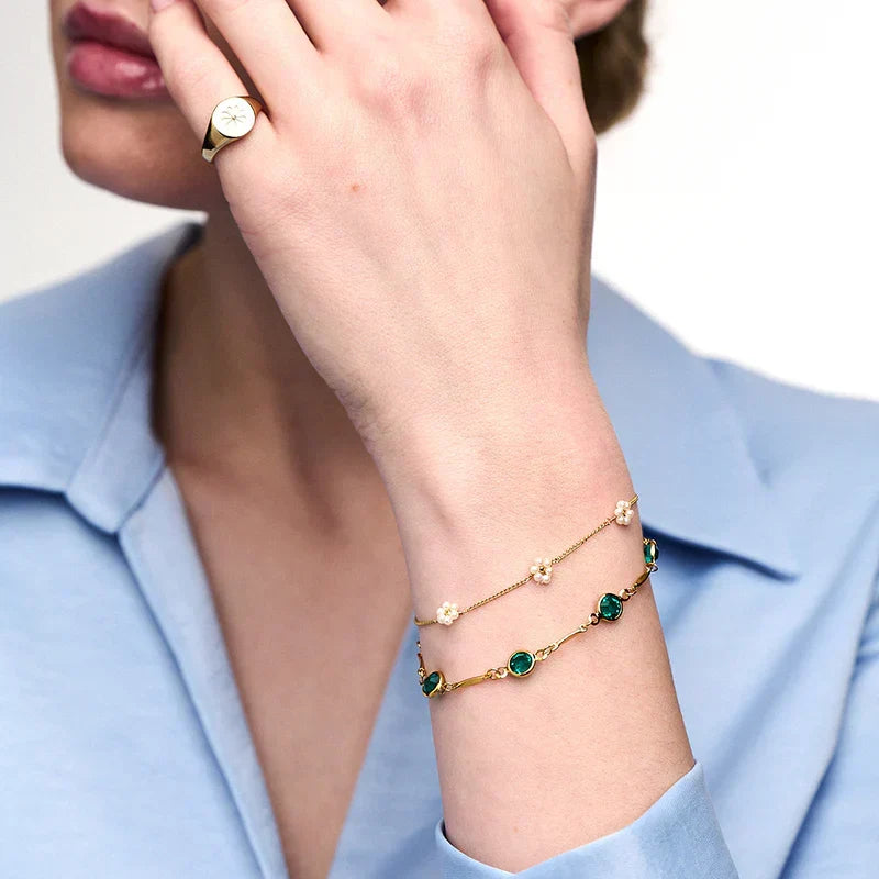 Smaragd schakelarmband in goud