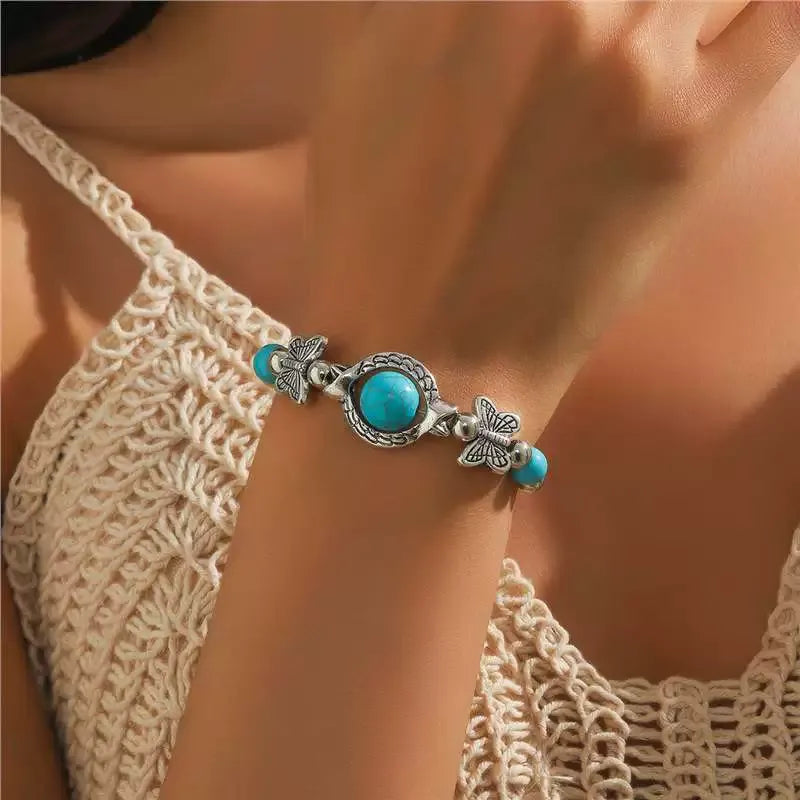 Vlinderarmband in wit goud