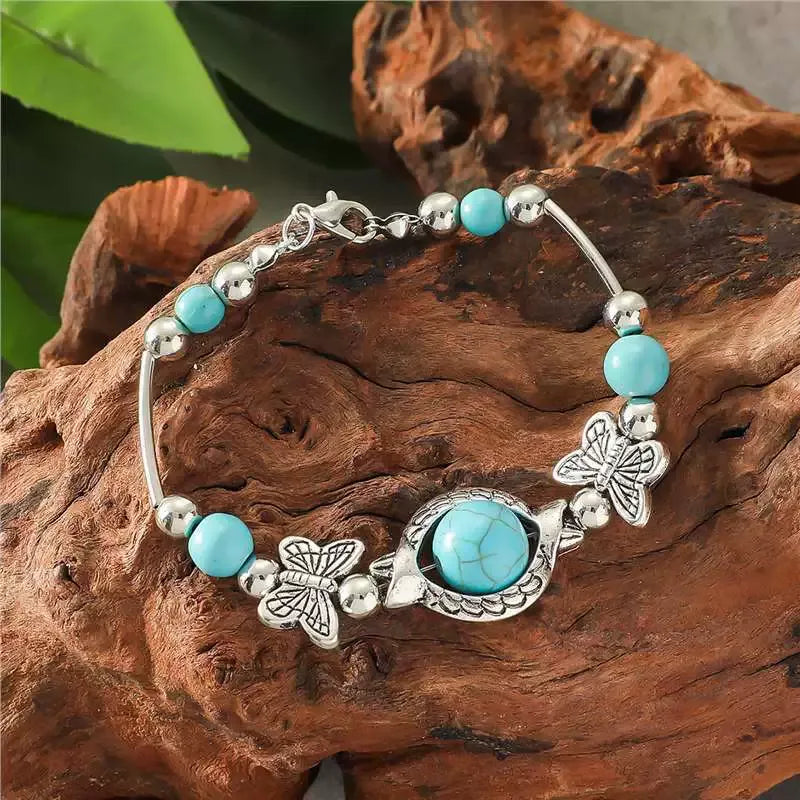 Vlinderarmband in wit goud