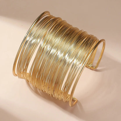 Open spiraalarmband in goud