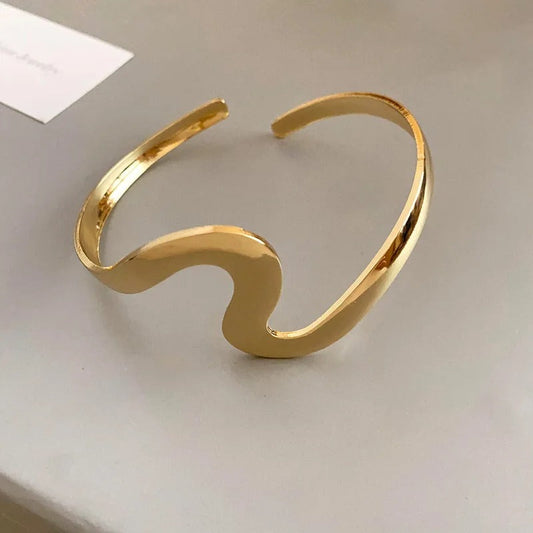 Klassieke open armband met golfmotief | Goud