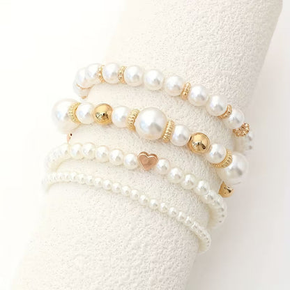 Armbanden met witte parels | Goud